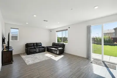 a living room with two chairs and a couch at Spacious 3BR Home with Charming Backyard home in Folsom