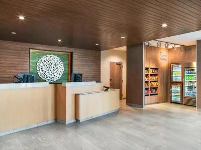 a lobby of a store with a counter and a cash register at Fairfield Inn & Suites Hanford in Hanford