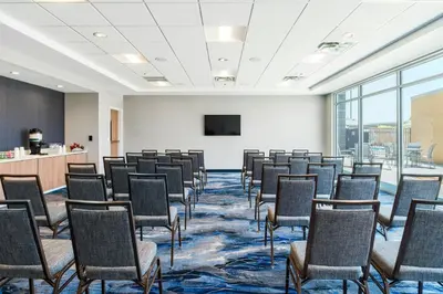 a room with rows of chairs in a classroom at Fairfield Inn & Suites Hanford in Hanford