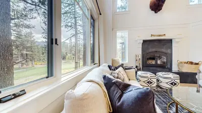 a living room with a couch and a fireplace at Timbers #12 townhouse in Mammoth Lakes