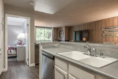 a kitchen with a sink and a counter top at Crestview Bldg A #49 - Spacious 2 Bedroom, 2 Bathroom, Sleeps 7 - Close to Canyon Lodge and Village in Mammoth Lakes