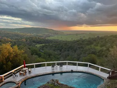a swimming pool on top of a mountain with a view at Breathtaking view of the Hills with HotTub, Pool and Pool Table in Marble Mountain