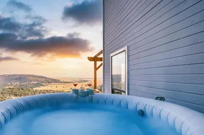 a hot tub on the side of a house at Breathtaking view of the Hills with HotTub, Pool and Pool Table in Marble Mountain