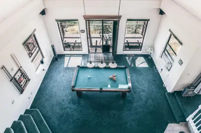 an overhead view of a pool table in a house at Breathtaking view of the Hills with HotTub, Pool and Pool Table in Marble Mountain