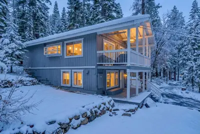 a house in the woods in the snow at Modern Tahoe Retreat with Grill Walk to Beach in Homewood
