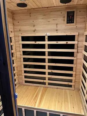 a sauna with a wooden door in a room at Mountain Dimension in Ponderosa Basin