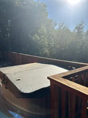a mattress on a deck with trees in the background at Mountain Dimension in Ponderosa Basin