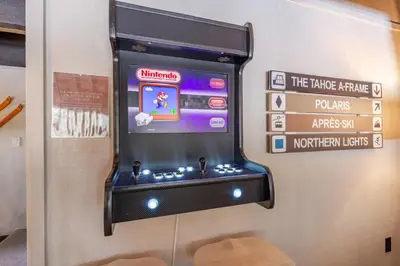 a video game machine on display at a museum at Mid Century Modern A-Frame Cabin at Northstar in Truckee