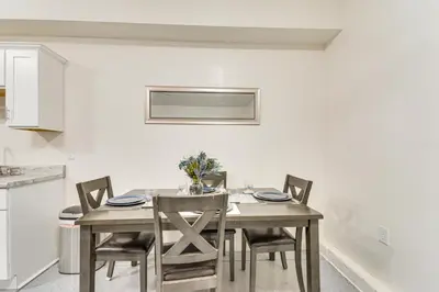 a dining room table and chairs in a kitchen at 10 Mi to Yosemite Lake Atwater Retreat in Atwater