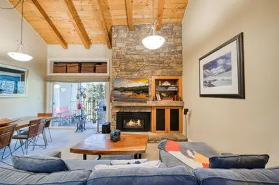 a living room with a couch and a fireplace at Carnelian Woods # 57 - 3 BR 2 BA Pet Friendly With HOA Amenities in Carnelian Bay