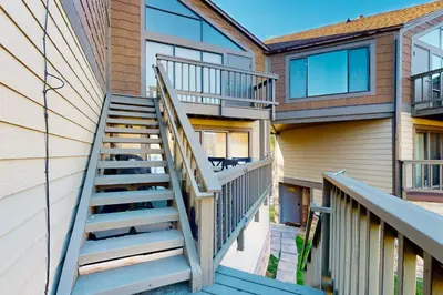 a staircase leading up to a house with glass windows at Keys to Paradise in South Lake Tahoe