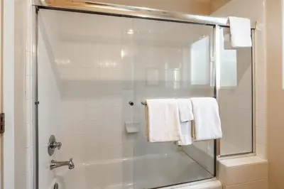 a bathroom with a glass shower stall with towels at Mammoth Gateway Village #1 - Highly Updated Townhome - Walk To Village 3 Bed+Loft, Sleeps 10 in Mammoth Lakes