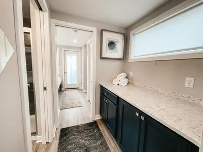 a bathroom with a counter and a window at Beautiful and Elegant River Front Cottage in Reno