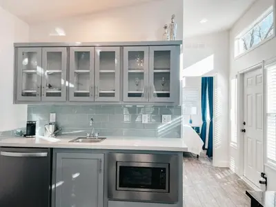 a kitchen with a sink and a counter top at Beautiful Courtyard Cottage Sapphire in Reno