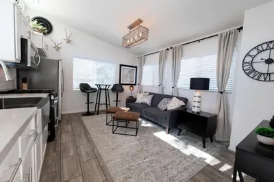 a living room with a couch and a table at Cottage on Historic Grounds Citrine in Reno