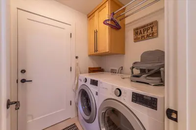 a washer and dryer in a small room at Cozy Palisades Tahoe Ski Cabin 3BR 3BA Free Shuttle to Lifts Book on Mobile for Promo Price in Alpine Meadows