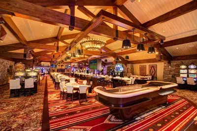 a casino with a bar with tables and chairs at Cozy Palisades Tahoe Ski Cabin 3BR 3BA Free Shuttle to Lifts Book on Mobile for Promo Price in Alpine Meadows