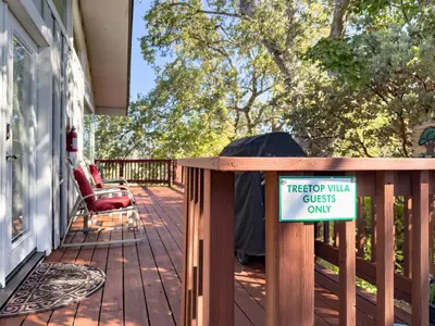 a porch with a sign that says tiger walk glass only at Yosemite Mountain Top - Treetop Villa in Mariposa