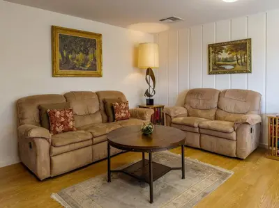 a living room with two couches and a table at Yosemite Mountain Top Retreat Hilltop Manor Pool Spa in Mariposa