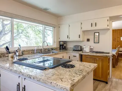 a kitchen with a sink and a counter top at Yosemite Mountain Top Retreat Hilltop Manor Pool Spa in Mariposa
