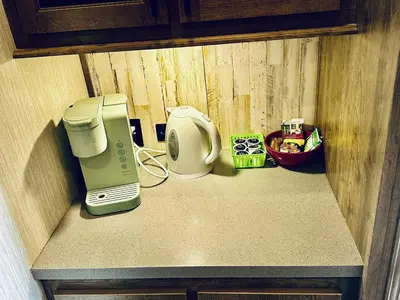 a counter with a coffee maker and a toaster on it at Puffy Panda RV-Hot Tub-Sleeps 2 in Ahwahnee
