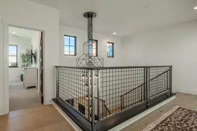 a dog in a cage in the hallway of a house at Creekhouse 1374 in Mammoth Lakes