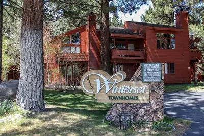 a house with a sign in front of it at Winterset #33 condo in Mammoth Lakes