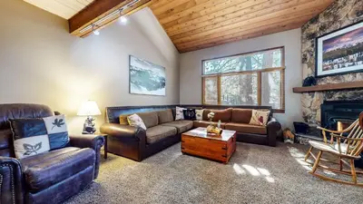 a living room with leather furniture and a fireplace at Winterset #33 condo in Mammoth Lakes
