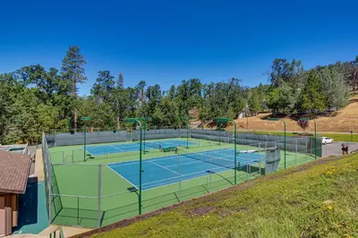 a tennis court on a hill with two courts at Green Abode in Groveland