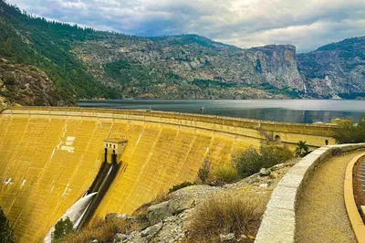 a view of a dam with a lake and a mountain at Green Abode in Groveland