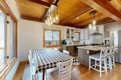 a kitchen with a table and chairs in a room at Tahoe West Shore Escape in Tahoe City