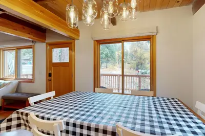 a dining room with a blue and white checkered table at Tahoe West Shore Escape in Tahoe City