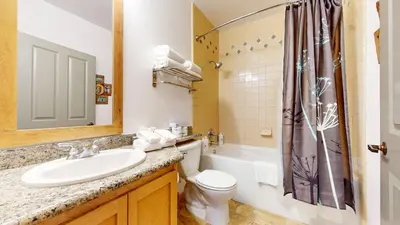 a bathroom with a sink and a toilet and a shower at Juniper Springs Lodge #246 condo in Mammoth Lakes