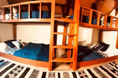 two bunk beds in a room with a bed at Happy Cabin Near Snow and Lake with Hot Tub, Dogs OK in Tahoe Vista