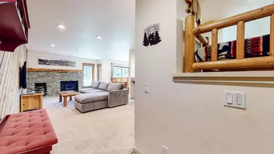 a living room with a couch and a fireplace at Snowcreek II #279 condo in Mammoth Lakes