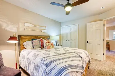 a bedroom with a bed and a ceiling fan at Sunset Retreat AC, Big Views & Dream Deck in Shaver Lake
