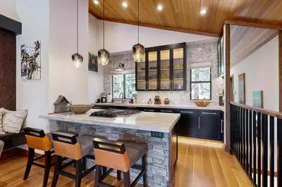 a kitchen with a large island with a counter top at Gold Bend Getaway in Truckee