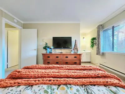 a bedroom with a bed and a tv on a dresser at Tahoe Shoreline Retreat - Close to Ski Resorts & HOA Amenities in Tahoe Vista