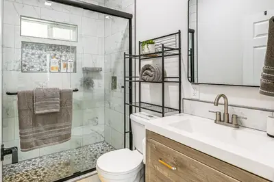 a bathroom with a shower and a toilet and a sink at Small-Town Charm and Patio Dining Home in Madera! in Madera