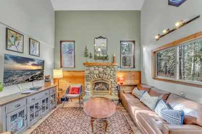 a living room with a couch and a fireplace at Tahoe City Retreat Forest Views and Fireplace in Tahoe City