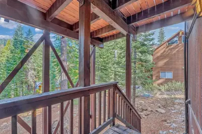 a view from the deck of a cabin in the woods at Tahoe Retreat with Scenic Views and Spacious Deck in Tahoe Vista