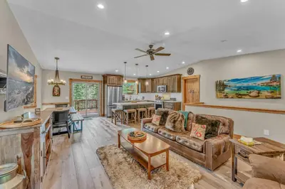 a living room with a couch and a table at Tahoe Retreat with Scenic Views and Spacious Deck in Tahoe Vista