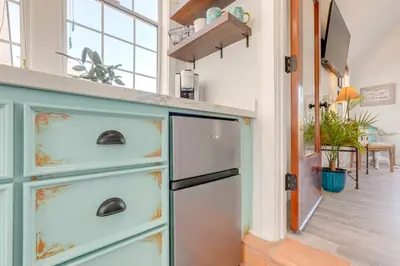 a kitchen with a blue chest of drawers at Steps to Sutter Creek Chic Wine Country Cottage in Sutter Creek