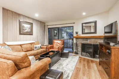 a living room with a couch and a fireplace at Summit #269 - 2 Bedrm 2 Bathrm Condo - Walk To Eagle Lodge Lifts in Mammoth Lakes