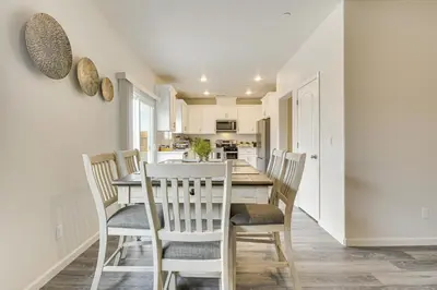 a kitchen and dining room with a table and chairs at Chowchilla Home with Private Patio! in Chowchilla