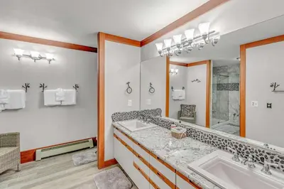 a bathroom with two sinks and a large mirror at 3-Level Getaway Minutes from Lake Tahoe in Tahoe City
