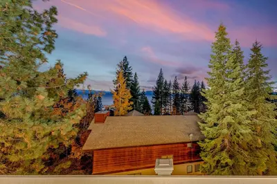 a house in the middle of a forest of trees at 3-Level Getaway Minutes from Lake Tahoe in Tahoe City