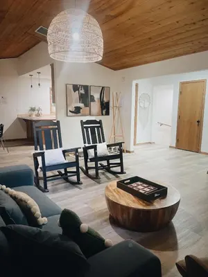 a living room with a couch and a table and chairs at Lovely Home in Pollock Pines with Hot Tub in Pollock Pines