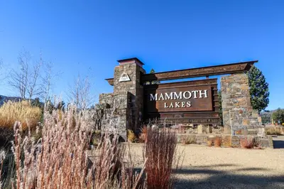 a sign for the mannum takes sign at a park at Woodlands #40 condo in Mammoth Lakes