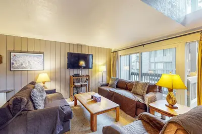 a living room with two couches and a table at Sierra Park Villas 56 L in Mammoth Lakes